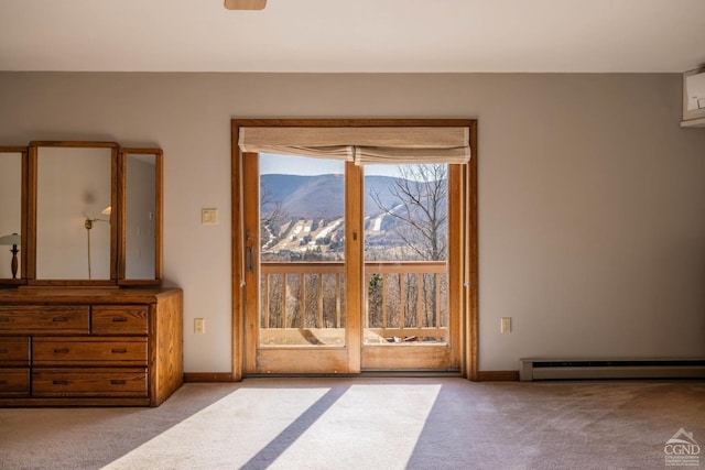 213 Botti Dr, Hunter, NY 12442 - entryway featuring a baseboard heating unit, carpet flooring, and a mountain view