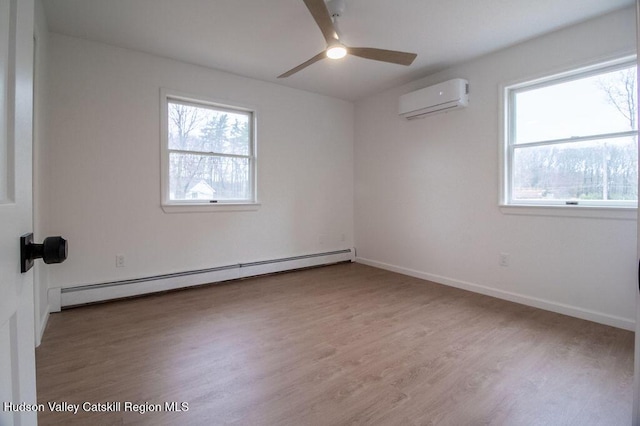 11 Old Farm Rd, Napanoch, NY 12458 - spare room with a wealth of natural light, an AC wall unit, a baseboard radiator, and ceiling fan