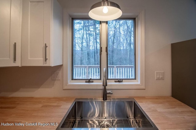 11 Old Farm Rd, Napanoch, NY 12458 - kitchen with wooden counters, a sink, and white cabinetry