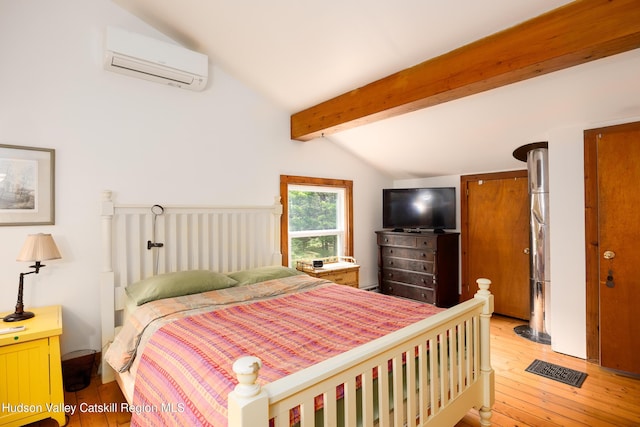 159 Pine Ln, Saugerties, NY 12477 - bedroom featuring an AC wall unit and light wood-style flooring