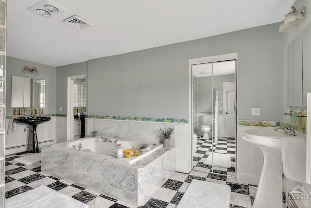311 County Route 13, Old Chatham, NY 12136 - full bath with a garden tub, toilet, and tile patterned floors