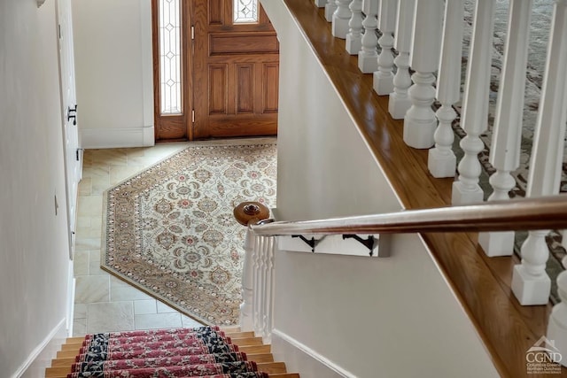 311 County Route 13, Old Chatham, NY 12136 - foyer with baseboards, stairway, and healthy amount of natural light