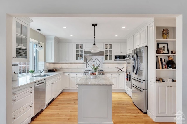 311 County Route 13, Old Chatham, NY 12136 - kitchen with stainless steel appliances, a sink, a center island, white cabinetry, and recessed lighting