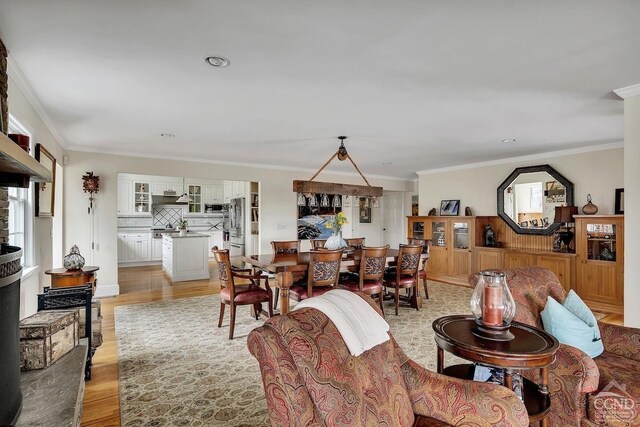 311 County Route 13, Old Chatham, NY 12136 - living room featuring light wood-type flooring, ornamental molding, and plenty of natural light