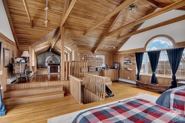 311 County Route 13, Old Chatham, NY 12136 - bedroom featuring wood ceiling, beamed ceiling, wood finished floors, baseboard heating, and a baseboard heating unit