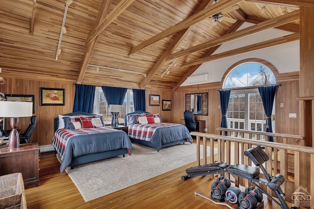 311 County Route 13, Old Chatham, NY 12136 - bedroom featuring wood finished floors, wooden walls, beamed ceiling, and wood ceiling