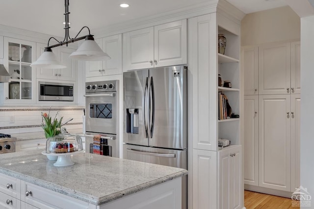 311 County Route 13, Old Chatham, NY 12136 - kitchen with appliances with stainless steel finishes, open shelves, white cabinetry, light stone counters, and glass insert cabinets