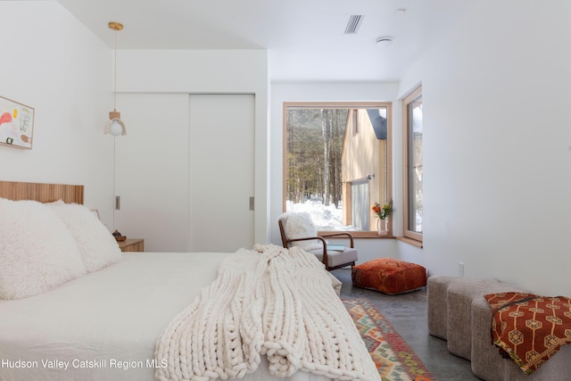 bedroom with visible vents and a closet