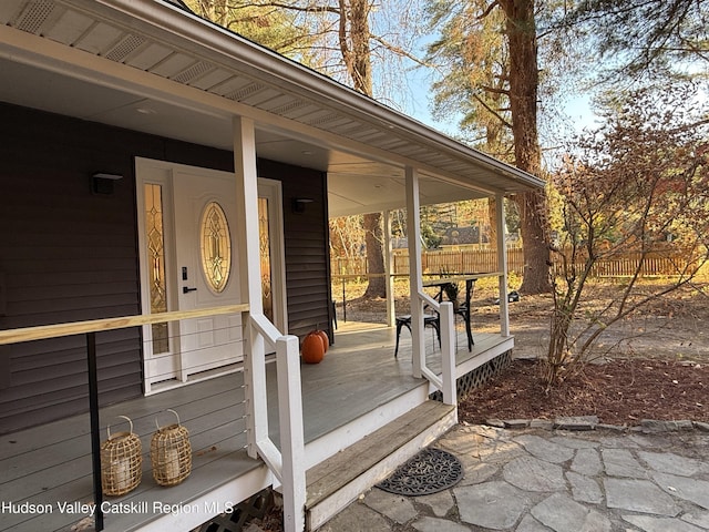 wooden terrace with a porch