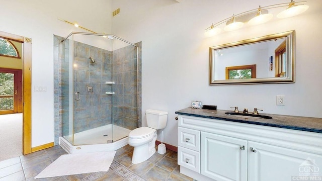 33 Elm Ridge Rd, Windham, NY 12496 - full bathroom with baseboards, a shower stall, toilet, vanity, and tile patterned floors