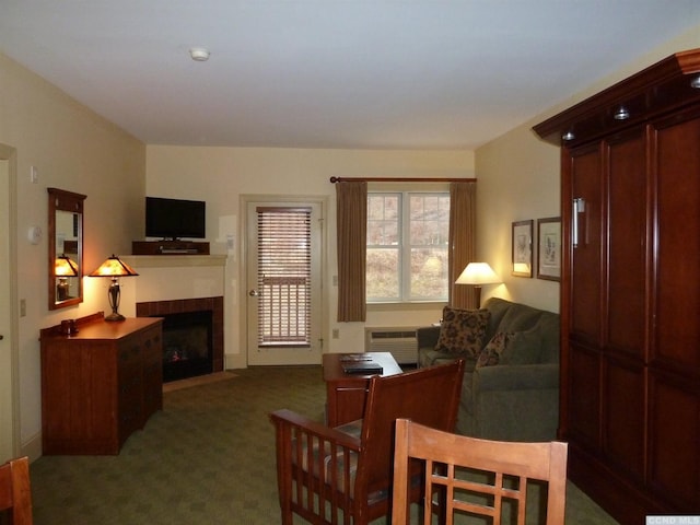 62 Liftside Dr Unit 312D1, Hunter, NY 12442 - carpeted living area featuring a tile fireplace and a wall mounted AC