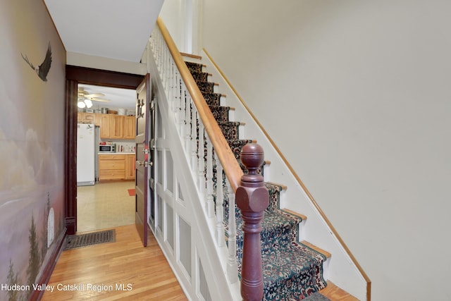 20-22 Milton Ave, Highland, NY 12528 - staircase with wood finished floors and ceiling fan