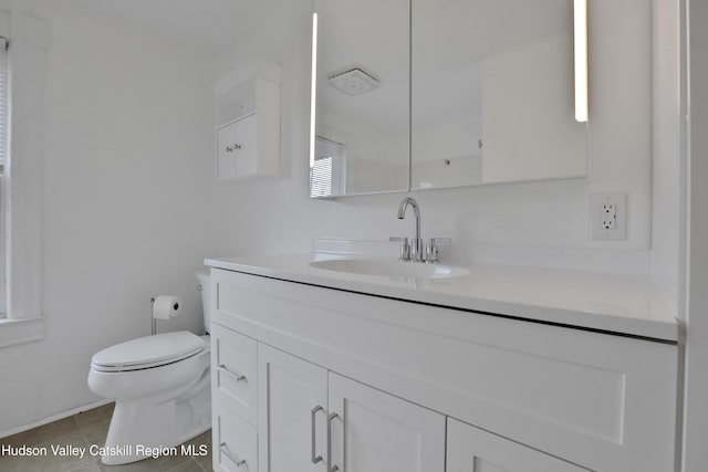 20-22 Milton Ave, Highland, NY 12528 - bathroom with toilet, vanity, and tile patterned floors