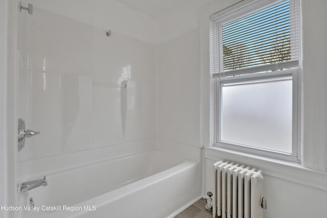 20-22 Milton Ave, Highland, NY 12528 - bathroom featuring radiator heating unit, plenty of natural light, and tub / shower combination