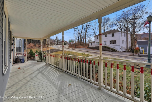 20-22 Milton Ave, Highland, NY 12528 - deck featuring covered porch and a residential view