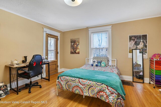 20-22 Milton Ave, Highland, NY 12528 - bedroom featuring hardwood / wood-style flooring, multiple windows, crown molding, and baseboards