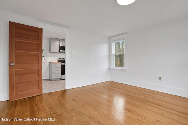 20-22 Milton Ave, Highland, NY 12528 - spare room featuring light wood-style floors and baseboards