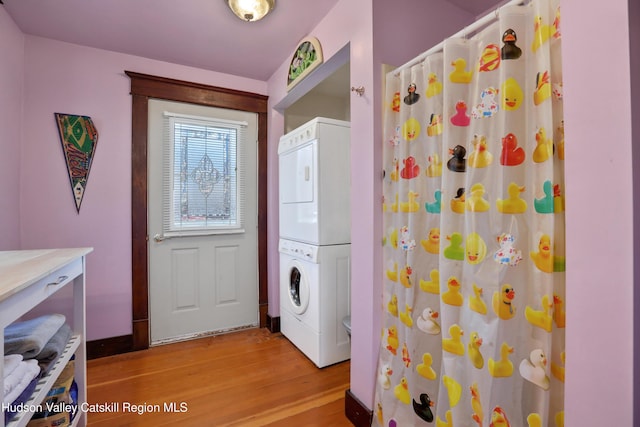 20-22 Milton Ave, Highland, NY 12528 - laundry area with estacked washer and dryer and light wood-style flooring