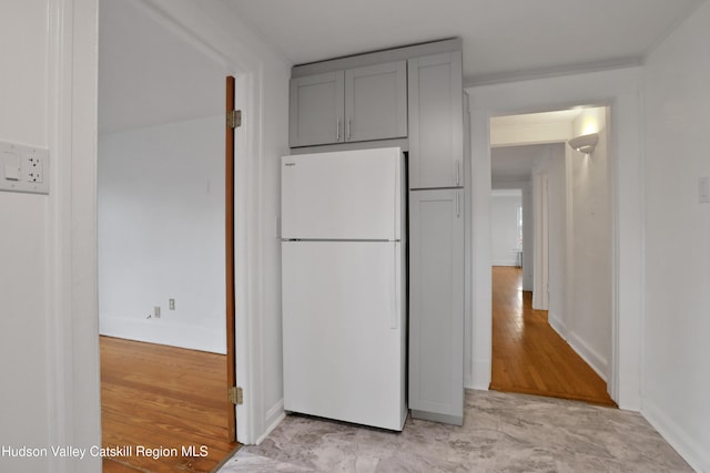 20-22 Milton Ave, Highland, NY 12528 - kitchen with freestanding refrigerator, gray cabinetry, baseboards, and light wood-type flooring