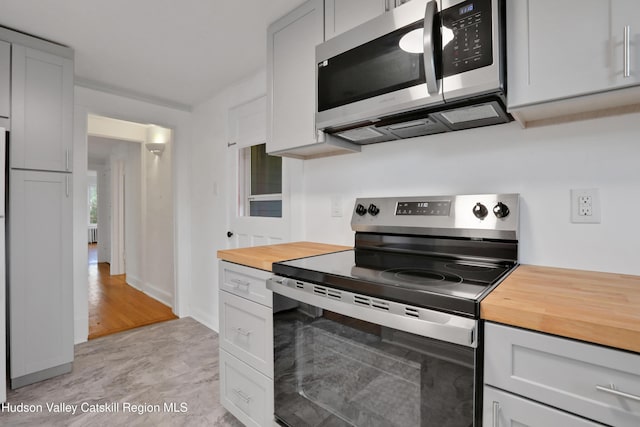 20-22 Milton Ave, Highland, NY 12528 - kitchen with stainless steel appliances, wood counters, and gray cabinets