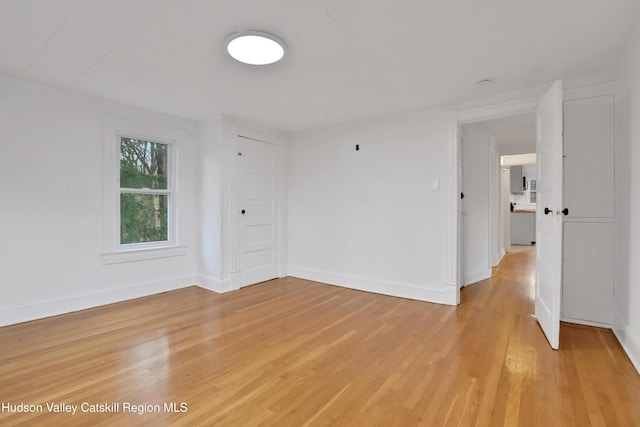 20-22 Milton Ave, Highland, NY 12528 - spare room with light wood-style flooring and baseboards