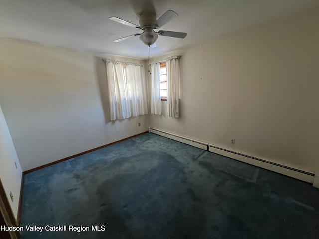 carpeted spare room featuring a baseboard radiator and ceiling fan