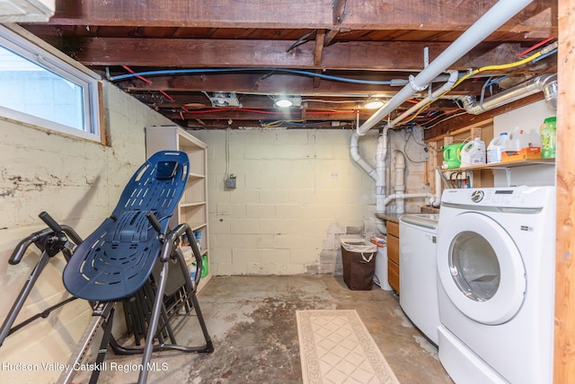 laundry area featuring separate washer and dryer and laundry area