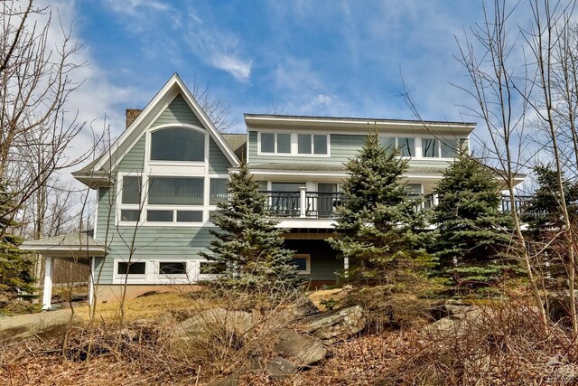 88 Gaby Ln, Hunter, NY 12442 - back of house featuring a chimney and a deck