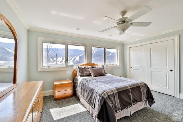 88 Gaby Ln, Hunter, NY 12442 - bedroom with multiple windows, a closet, baseboards, crown molding, and dark colored carpet