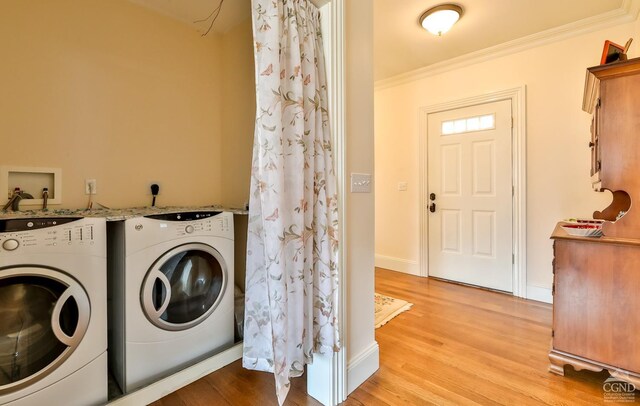 88 Gaby Ln, Hunter, NY 12442 - washroom with washer and dryer, light wood finished floors, crown molding, and baseboards