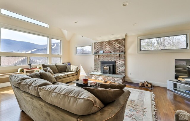 88 Gaby Ln, Hunter, NY 12442 - living room with a mountain view, plenty of natural light, wood finished floors, and ornamental molding