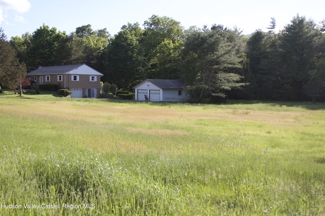 55 Harry Wells Rd, Saugerties, NY 12477 - view of yard featuring a detached garage and an outdoor structure