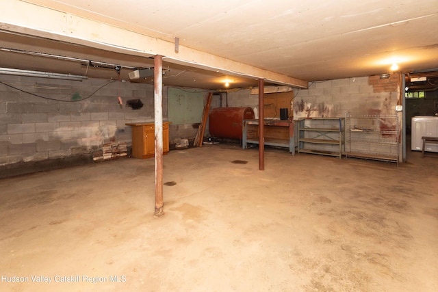 55 Harry Wells Rd, Saugerties, NY 12477 - unfinished below grade area featuring oil tank and washer / clothes dryer