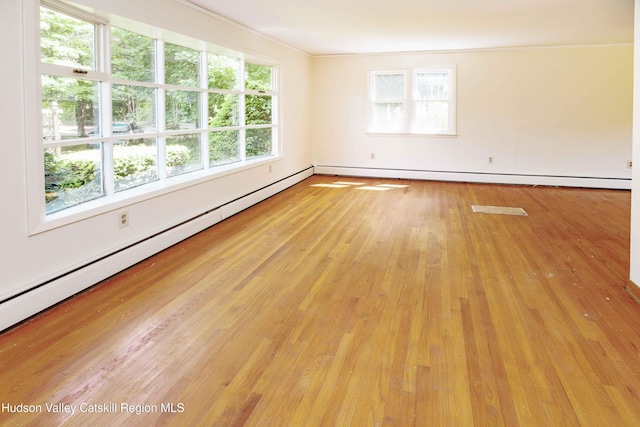 55 Harry Wells Rd, Saugerties, NY 12477 - spare room with wood-type flooring and a baseboard heating unit