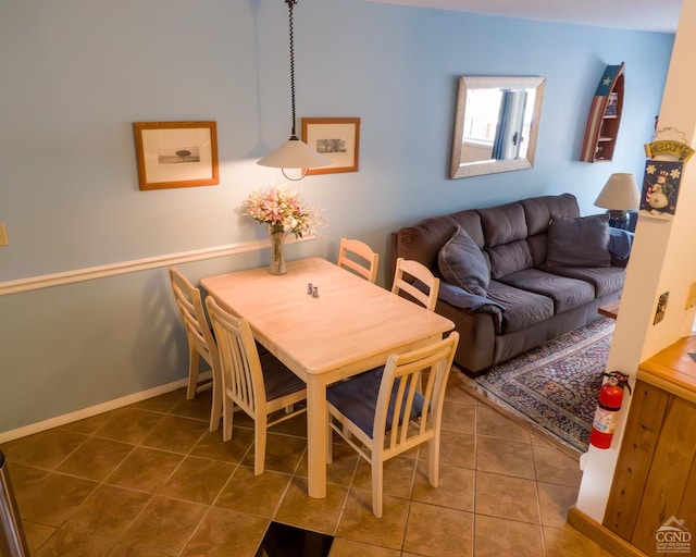 tiled dining area with baseboards