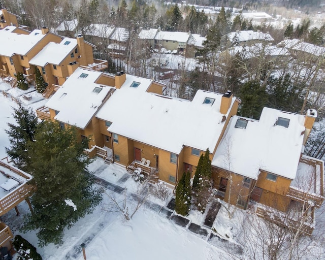 snowy aerial view featuring a residential view
