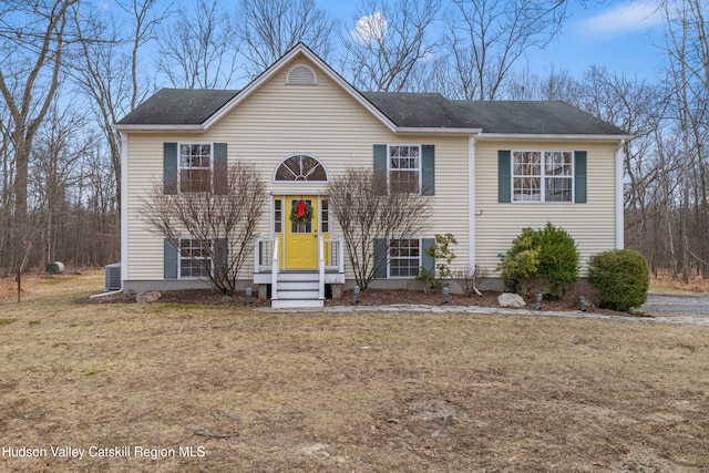 raised ranch with a front lawn