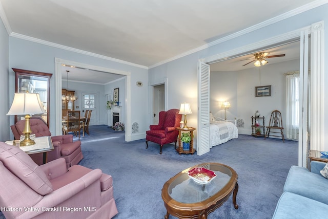 carpeted living room with ornamental molding and ceiling fan with notable chandelier