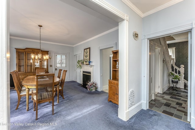 carpeted dining space with crown molding and a chandelier