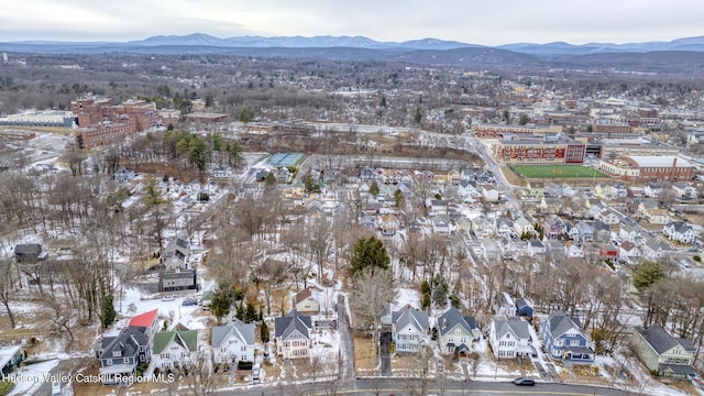 snowy aerial view featuring a mountain view