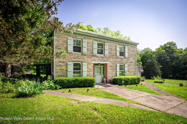 660-668 N Chodikee Lake Rd, Highland, NY 12528 - colonial home with a front yard and stone siding