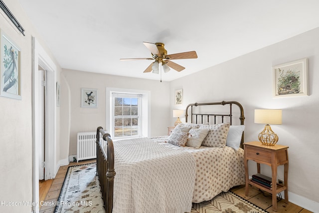 660-668 N Chodikee Lake Rd, Highland, NY 12528 - bedroom featuring radiator heating unit, baseboards, and ceiling fan