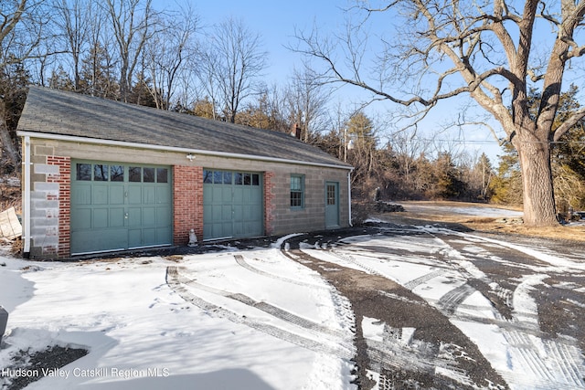 660-668 N Chodikee Lake Rd, Highland, NY 12528 - snow covered garage featuring a garage