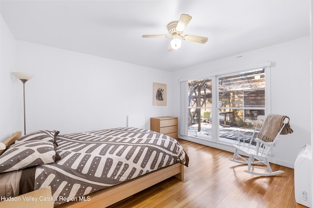 660-668 N Chodikee Lake Rd, Highland, NY 12528 - bedroom with wood finished floors and a ceiling fan