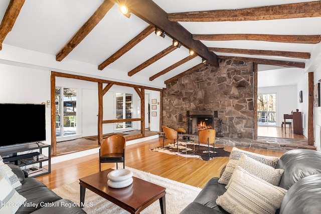 660-668 N Chodikee Lake Rd, Highland, NY 12528 - living room featuring wood finished floors and a fireplace