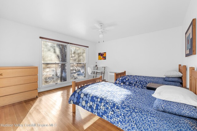 660-668 N Chodikee Lake Rd, Highland, NY 12528 - bedroom featuring wood finished floors and a ceiling fan