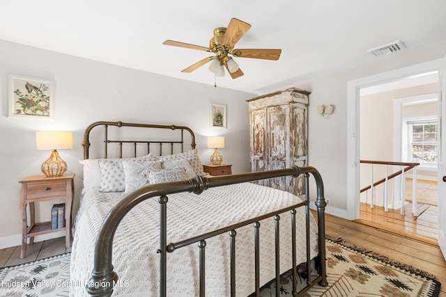 660-668 N Chodikee Lake Rd, Highland, NY 12528 - bedroom with baseboards, light wood-style floors, and a ceiling fan