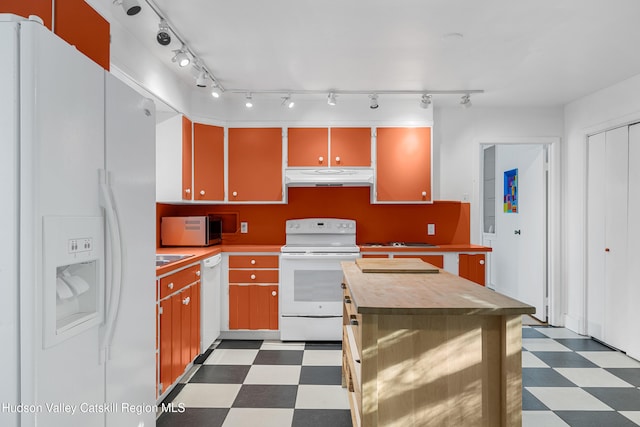660-668 N Chodikee Lake Rd, Highland, NY 12528 - kitchen featuring white appliances, under cabinet range hood, tile patterned floors, wood counters, and rail lighting