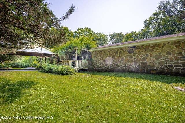 660-668 N Chodikee Lake Rd, Highland, NY 12528 - view of green lawn with a wooden deck