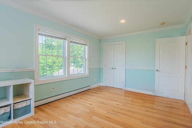 208 Paul Saxe Rd, Catskill, NY 12414 - unfurnished bedroom featuring a baseboard heating unit, wood finished floors, crown molding, a closet, and recessed lighting